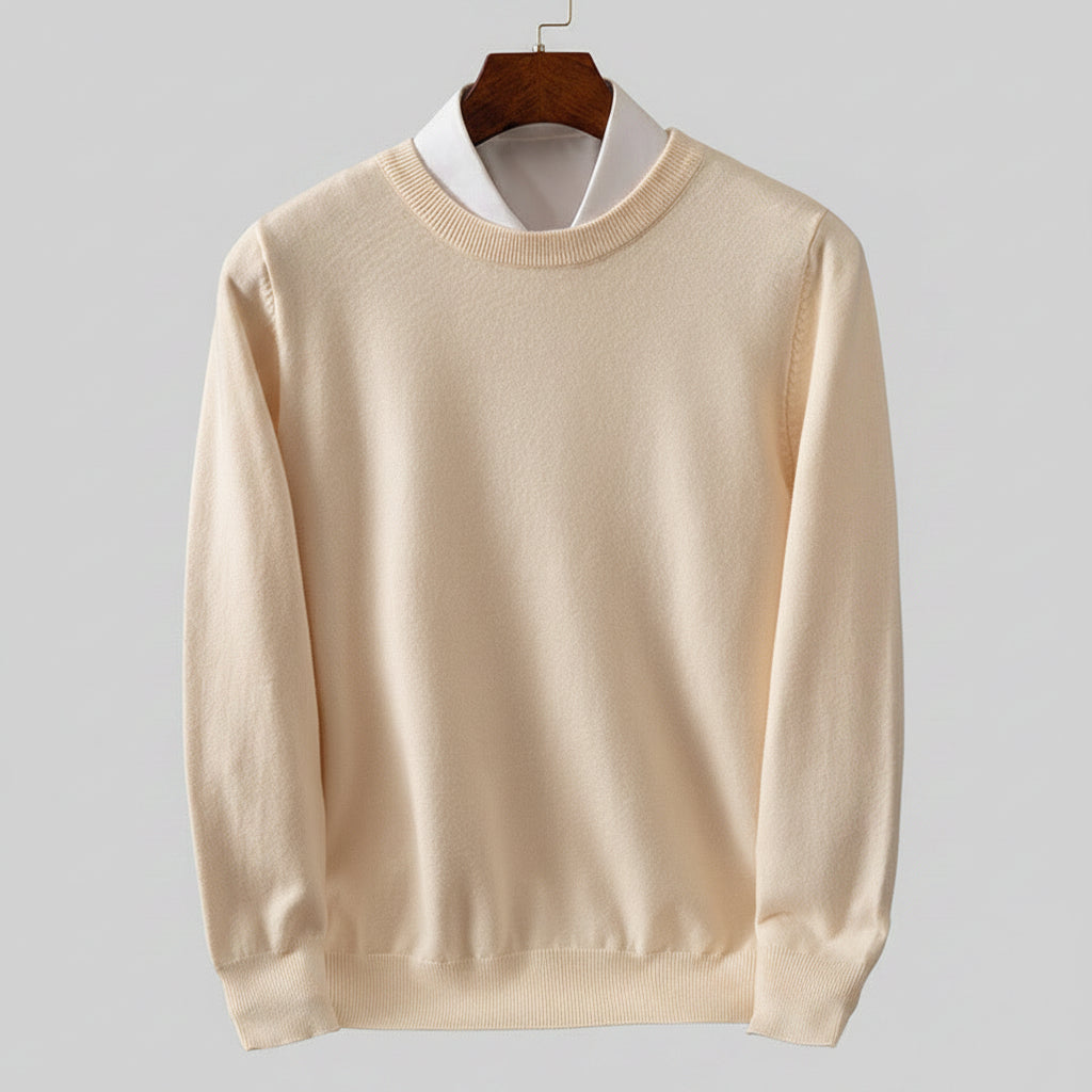 Beige sweater on a wooden hanger against a dark background