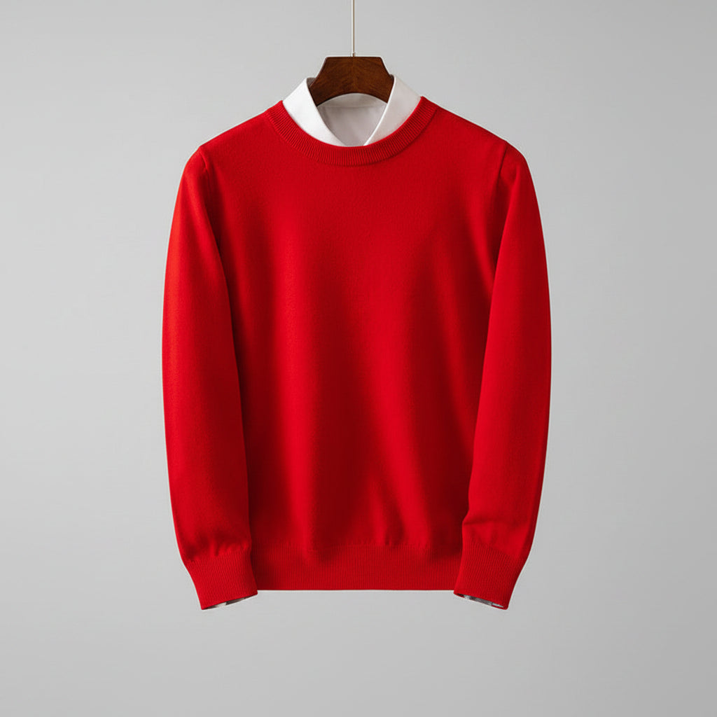 Red sweater on a hanger against a dark wooden background