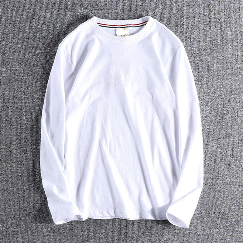 White long-sleeve shirt on a gray background