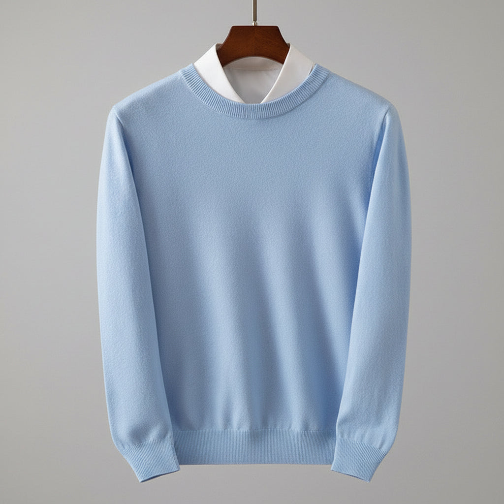 Light blue sweater on a wooden hanger against a dark wooden background