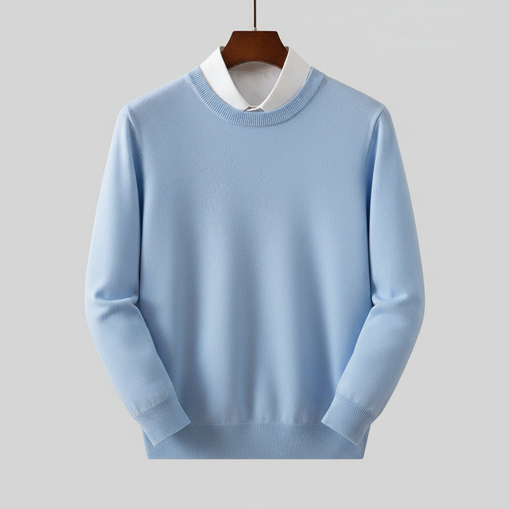 Light blue sweater on a wooden hanger against a dark wooden background