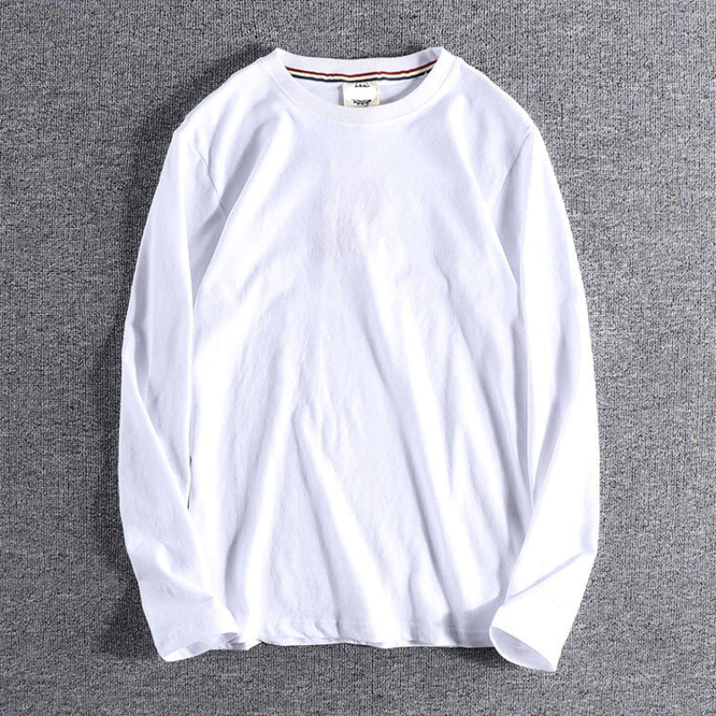 White long-sleeve shirt on a gray background