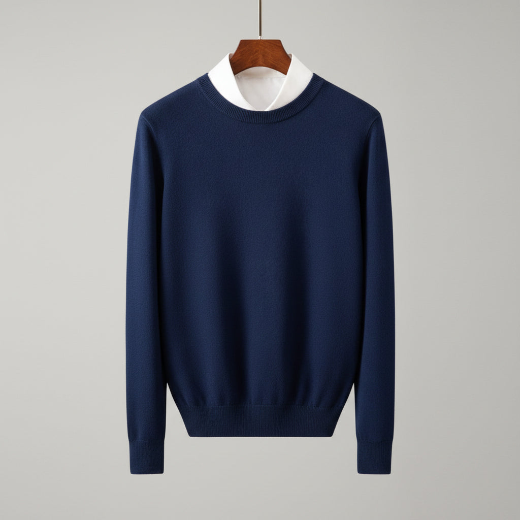 Blue sweater on a hanger against a wooden cabinet background